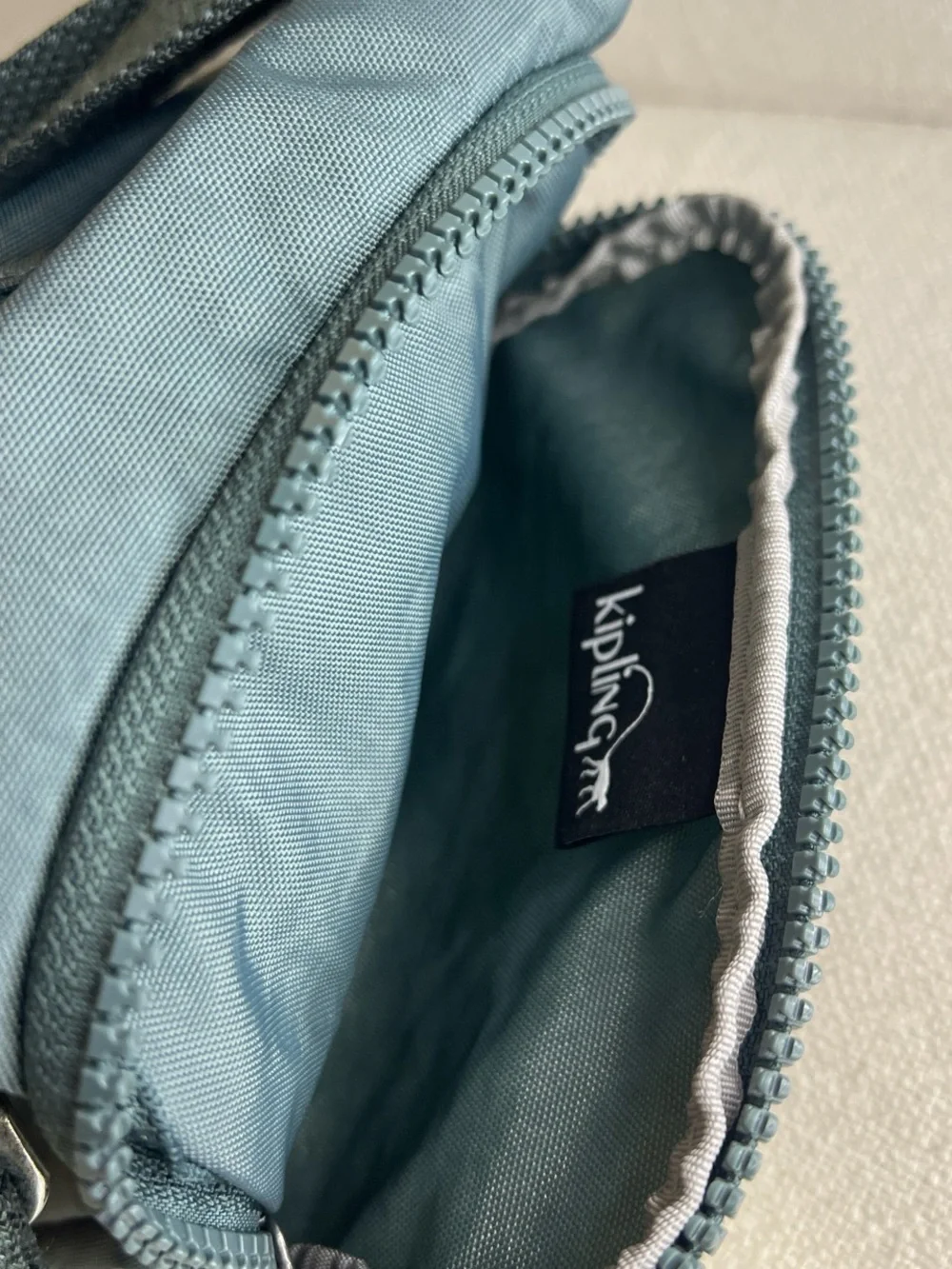Kipling Dual Mini Crossbody Bags in blue and Green